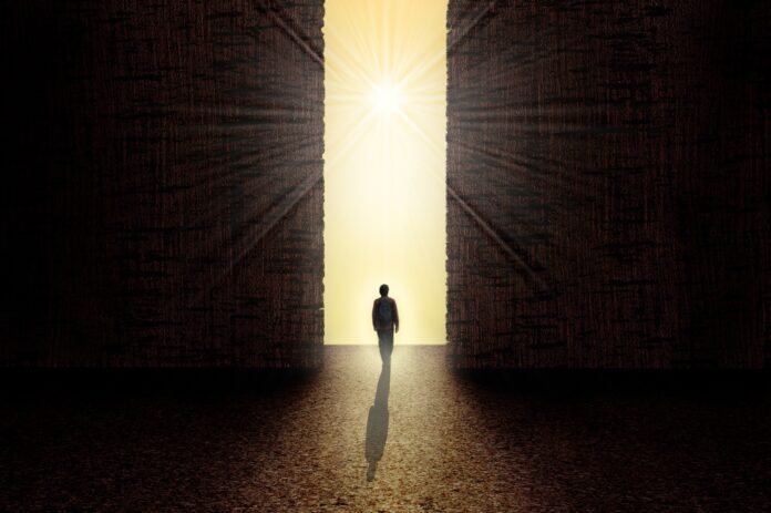 Man standing in front of the light